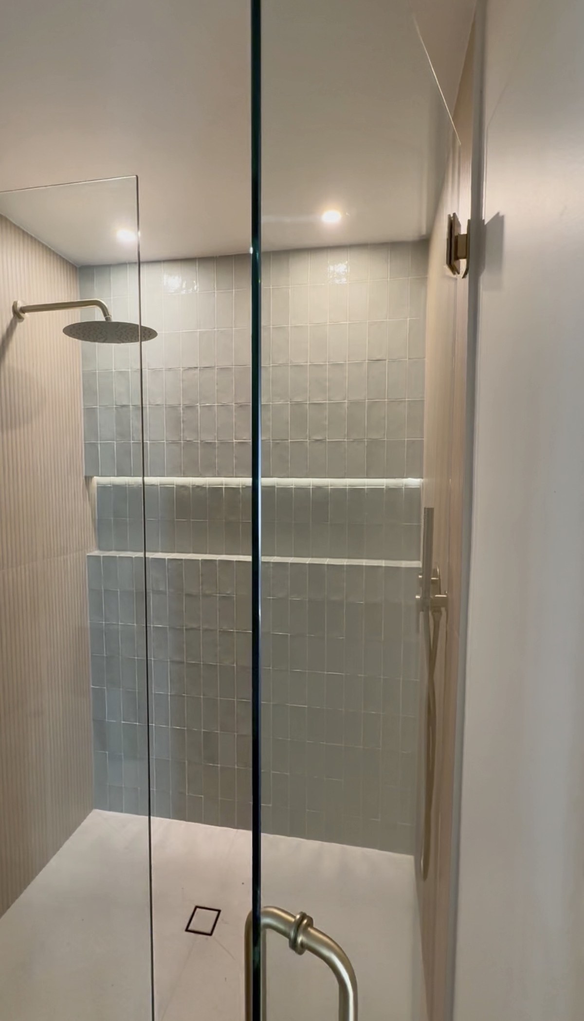 Walk-in shower with marble tile